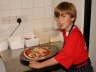 Matthew with a prepared pizza